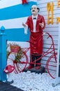 Elegant statue of a waiter in front