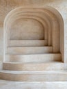 Elegant stone staircase with arched entryway