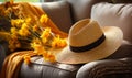 Elegant straw hat with stylish sunglasses on a soft couch an inviting symbol of leisure relaxation and summer vacations