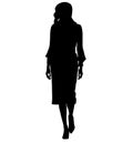 Elegant and stylish business woman very expressive goes to work on foot, from work. Dressed in knee-length business dress Royalty Free Stock Photo