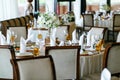 Elegant stylish decorated wedding reception tables with glasses Royalty Free Stock Photo