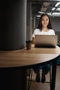 Elegant stylish female entrepreneur is posing at the photo camera in the office Royalty Free Stock Photo