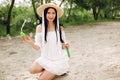 Elegant and stylish girl in a spring park