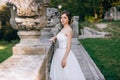 Elegant stylish sweet young beautiful happy bride girl woman in amazing wedding dress stands on the old palace. Wedding day Royalty Free Stock Photo