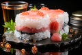 Elegant sushi roll topped with fresh salmon, roe, and garnish on a sleek black plate