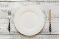 Elegant table place setting on white wooden table. Top view Royalty Free Stock Photo