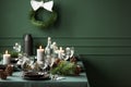 Elegant table set for christmas dinner, copy space on empty green wall Royalty Free Stock Photo