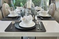 Elegant table set on dining table in modern style dining room Royalty Free Stock Photo