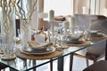 Elegant table set in modern style dining room Royalty Free Stock Photo