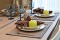 Elegant table set in modern style dining room Royalty Free Stock Photo