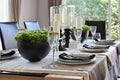 Elegant table set in modern style dining room Royalty Free Stock Photo