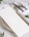 Elegant Table setting with a card decorated with eucalyptus branches close up, Wedding mockup Royalty Free Stock Photo