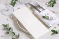 Elegant Table setting with a card decorated with eucalyptus branches close up, Wedding mockup Royalty Free Stock Photo