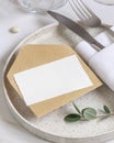 Elegant Table setting with a card decorated with eucalyptus branches close up, Wedding mockup Royalty Free Stock Photo