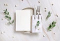 Elegant Table setting with a card decorated with eucalyptus branches top view, Wedding mockup Royalty Free Stock Photo