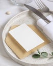 Elegant Table setting with a card decorated with eucalyptus branches close up, Wedding mockup Royalty Free Stock Photo