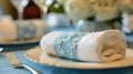 Elegant Table Setting with Embroidered Napkin and Fine Dinnerware for Upscale Wedding or Banquet Event