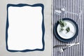Elegant table setting and empty menu on marble table, flat lay. Space for text Royalty Free Stock Photo