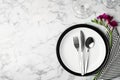 Elegant table setting with freesia on white marble background. Space for text Royalty Free Stock Photo