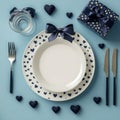 Elegant table setting with heart themed decor for a romantic dinner on a blue background Royalty Free Stock Photo