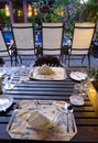 Elegant table setting outdoors, ethnic batik Royalty Free Stock Photo