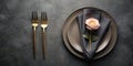 Elegant table setting with rose and gold flatware on dark surface. Generative AI Royalty Free Stock Photo