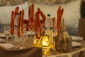 Elegant table setting in a traditional Moroccan restaurant with warm lighting. Royalty Free Stock Photo