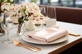 Elegant table setting in white beige tones ready for the arrival of guests. Table set for an event party or wedding reception. Royalty Free Stock Photo