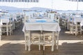 Elegant table setting with wine glass, white plate and blue napkin in restaurant . Nice dining table set with arranged silverware Royalty Free Stock Photo