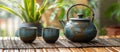 Elegant Tea Pot and Two Cups on Table Royalty Free Stock Photo