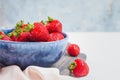 Elegant tender strawberry background. Ripe summer red berries. Filled blue bowl or plate by seasonal strawberries. Sweet berry for Royalty Free Stock Photo