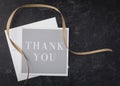 Elegant thank you note with gray and black with white from above Royalty Free Stock Photo