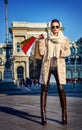 Elegant tourist woman shopper in Milan, Italy standing Royalty Free Stock Photo