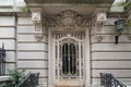 elegant townhouse entrance with ornate wrought iron grill on door Royalty Free Stock Photo