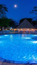 Elegant tropical resort pool at night with palm trees reflecting in water, perfect vacation spot
