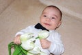 Elegant baby boy with flowers Royalty Free Stock Photo