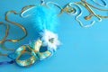 elegant venetian mask on blue wooden background Royalty Free Stock Photo