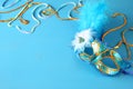 elegant venetian mask on blue wooden background Royalty Free Stock Photo