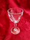 Elegant Vintage Cut Crystal Glass Stemware on Red Background Royalty Free Stock Photo