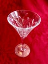 Elegant Vintage Cut Crystal Glass Stemware on Red Background