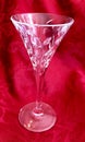 Elegant Vintage Cut Crystal Glass Stemware on Red Background