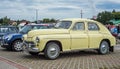 Elegant vintage old yellow Polish car Warszawa M20 parked