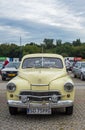 Elegant vintage old yellow Polish car Warszawa M20 parked