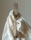 Elegant Vintage Silver Fork on a White Cloth Royalty Free Stock Photo