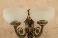 Elegant vintage wall lamp with bronze or brass finish Royalty Free Stock Photo