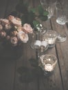 Elegant vintage wedding table decoration with roses and candles Royalty Free Stock Photo