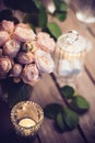 Elegant vintage wedding table decoration with roses and candles Royalty Free Stock Photo