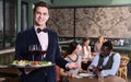 Elegant waiter with serving tray Royalty Free Stock Photo