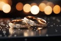 Elegant wedding bands in a glittering, bokeh style closeup photo