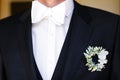 Elegant wedding boutonniere on the groom& x27;s suit Royalty Free Stock Photo